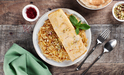 Balaleet - traditional Arabic breakfast. Sweet vermicelli with saffron, cardamom and egg omelette. Arabic, Emirati food.