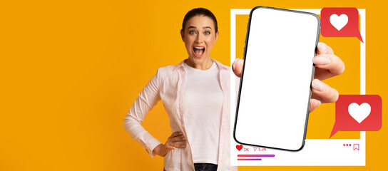 A young influencer enthusiastically displays a smartphone featuring an empty screen, surrounded by...