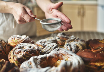 Sprinkling Powdered Sugar on Easter Bread