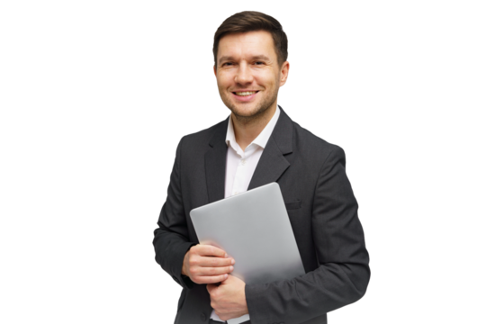 Professional man in a suit holding a laptop while smiling confidently in a studio setting