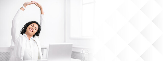 Relaxation At Work. Calm latin businesswoman stretching on chair at office during break, hands up....