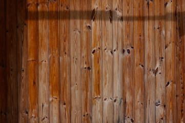 Natural beauty of rustic wooden texture highlighted by gentle shadows at midday