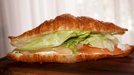 croissant with salad and salmon