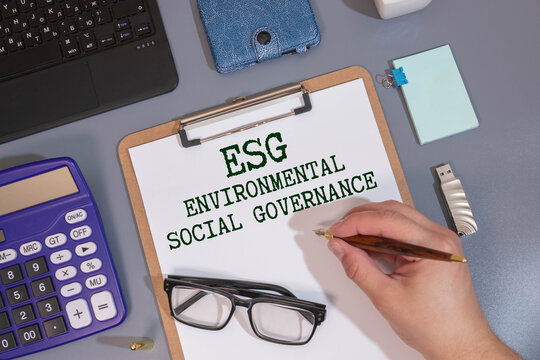 ESG - Environmental Social and Governance write on sticky notes isolated