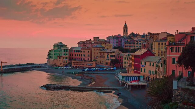 The tranquil atmosphere of Bogliasco during a beautiful sunset. The vibrant sky and the calm sea create a picturesque view of this charming Ligurian village
