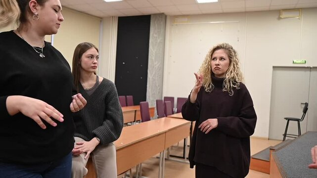 Students learn sign language at university. 