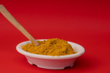 Curcuma longa - Turmeric is a very healthy species in spoon and bowl
