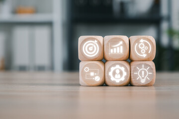 Wooden blocks with icons symbolize business process management, showcasing strategy, innovation,...