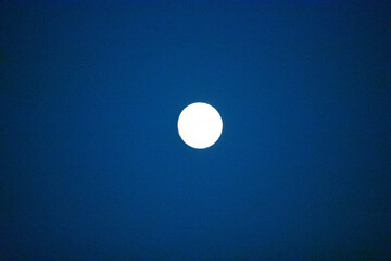 Full moon in a dark blue sky