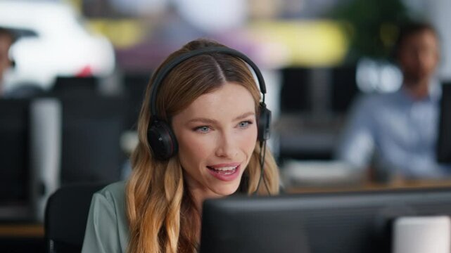Customer support representative talking wearing headset in call center closeup. 