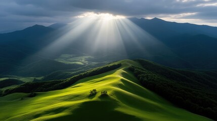 Fototapeta premium Majestic sun rays piercing through clouds over rolling hills. Lush green valleys and mountain ranges