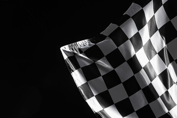 One racing checkered flag on black background, space for text