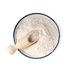Brown rice flour and scoop in bowl isolated on white, top view