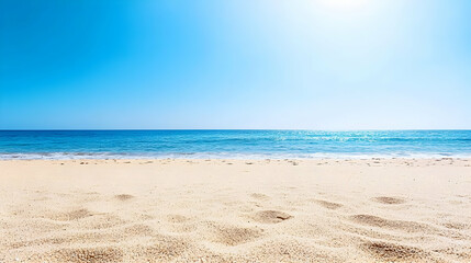 Fototapeta premium Sandy Beach Under Bright Blue Sky With Calm Ocean Waters During Sunny Day