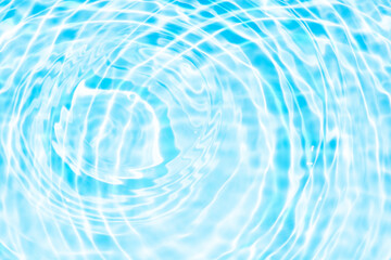 Blue water with ripples on the surface. Defocus blurred transparent blue colored clear calm water surface texture with splashes and bubbles. Water waves with shining pattern texture background.