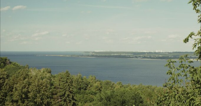 Tranquil Volga river view overlooking lush green forest