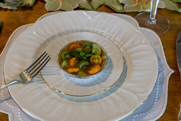 Green kiwi berry, grape and kumquat tart with passion fruit curd