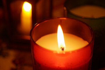 Warm glow from candles illuminating a cozy indoor setting