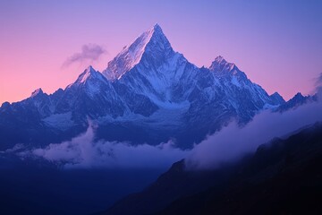 Majestic snow capped mountain peaks illuminated by the sunrise glow