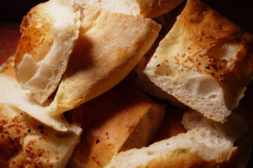 Freshly baked bread pieces with a crispy crust and soft interior