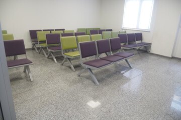 Waiting area with modern seating in a bright, empty room