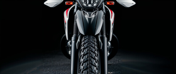 Front view of motocross bike on black background