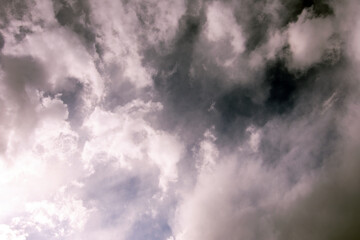sun piercing dark winter sky 