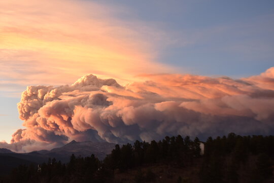 Massive cloud formation breaking over the mountains in Rollinsville Colorado