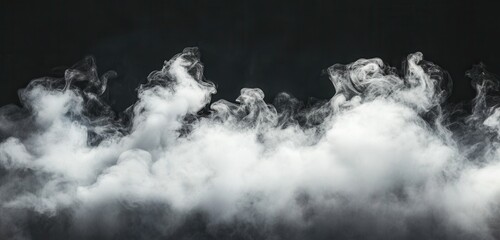 Dramatic clouds of smoke on a dark background.