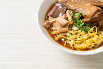 egg noodles with stewed and braised duck in brown soup