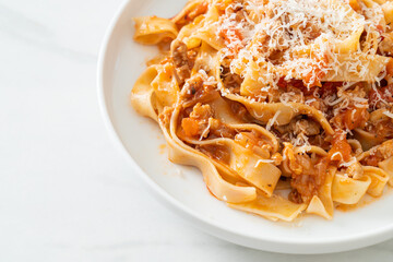 Homemade pasta fettuccine bolognese with cheese