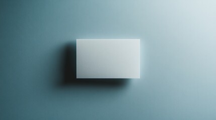 Blank white card on a flat surface, symbolizing simplicity and clarity in design.