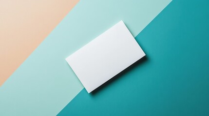 Blank white card on a flat surface, symbolizing simplicity and clarity in design.