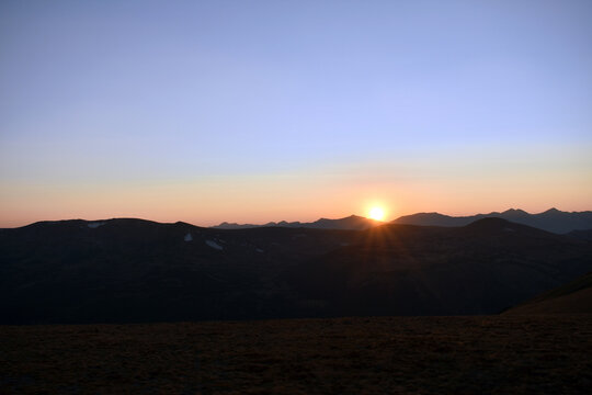 Sun breaking over the mountains in the morning