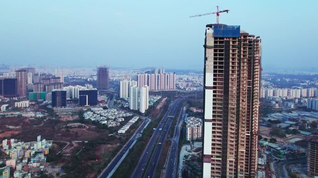 under construction Tallest building at Financial district, nanakramguda, hyderabad, telangana, india. day time, closeup, semi orbit, drone shot, 4k.