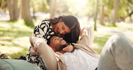 Laughing, bonding and couple on date, picnic and joke for conversation in nature, smile or relationship. Embrace, man and romance with woman on anniversary, outdoor and people with commitment or park