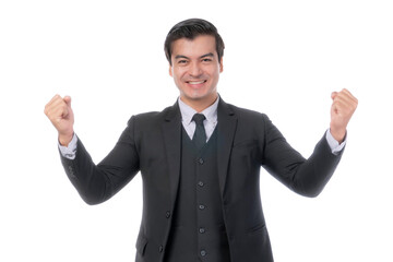 Excited young businessman in a black suit celebrating success with raised fists, smiling and standing isolated on a transparent background, concept of achievement, motivation, and business success