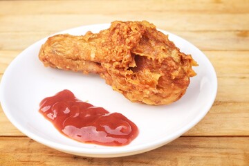 Fried chicken legs with tomato sauce