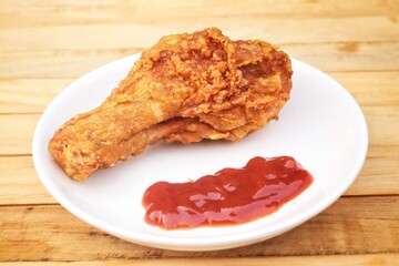 Fried chicken legs with tomato sauce