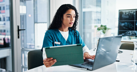 Woman, nurse or reading with laptop or tablet for medical research, discovery or study at hospital....