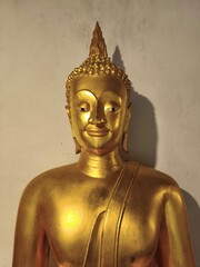 golden buddha statueBuddha statues around the temple at Wat Phra Sri Rattana Mahathat...