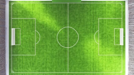 Naklejka premium Aerial view of a pristine soccer field with goals, surrounded by a vibrant urban landscape