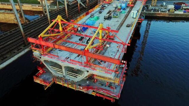 Rail Baltica bridge construction progresses over Daugava, modern engineering
