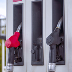 View of the Diesel and petrol fuel pistols at a gas station