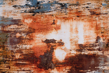 A background of peeling paint and rusty old metal