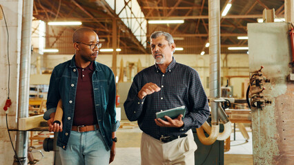 Talking, carpenter or people on tablet in workshop for factory, check inventory and furniture manufacturing. Woodworking, carpentry and online update for timber, lumber and construction business