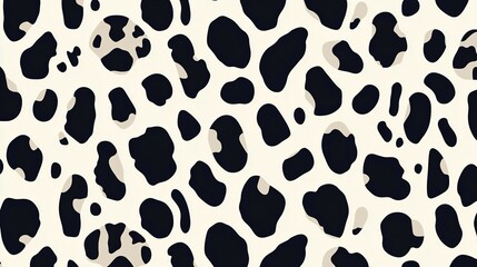 A pattern showing black and white shapes across a tan background surface