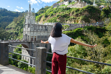 Woman praying in front of the church in Las Lajas, southern Colombia