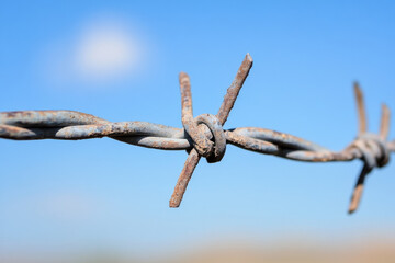 Broken barbed wire fence