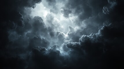 Obraz premium A dark gray, almost black background with softly glowing, ethereal clouds in shades of white and blue